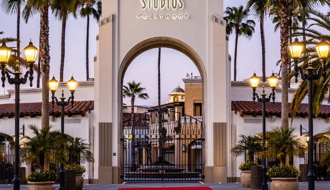 Neon Auto Transport services at Universal Studios Hollywood archway representing California car shipping destinations