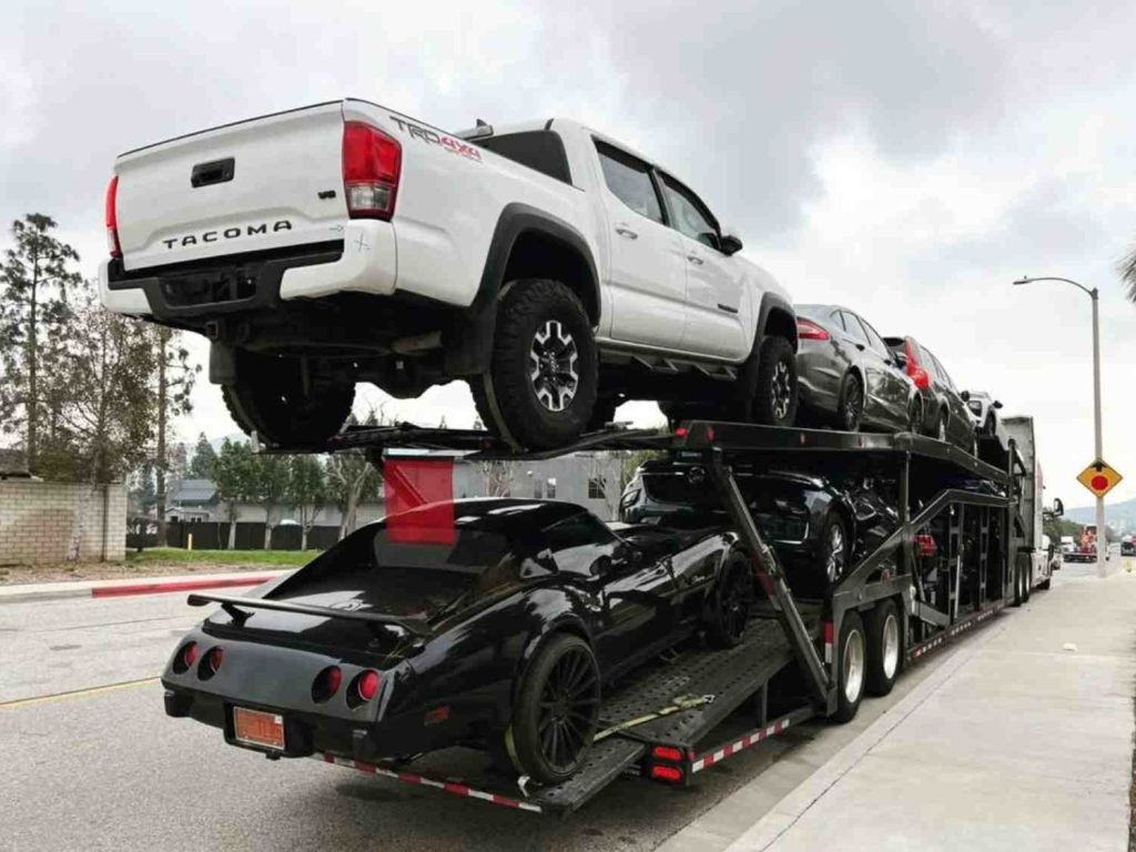 Neon Auto Transport performing expedited auto transport with a priority truck and trailer moving a time-sensitive vehicle delivery across states.